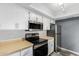 Updated kitchen, equipped with stainless steel appliances and wood laminate countertops at 1920 W Lindner Ave # 147, Mesa, AZ 85202