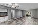 Living room with tile floors, ceiling fan, and access to patio at 1920 W Lindner Ave # 147, Mesa, AZ 85202