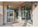 Covered patio with sliding glass doors leading to the backyard at 21885 S 215Th S St, Queen Creek, AZ 85142