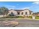 Home's exterior featuring a welcoming front porch and solar panels at 21934 E Stone Crest Ct, Queen Creek, AZ 85142