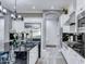 Modern kitchen with stainless steel appliances and white shaker cabinets at 21934 E Stone Crest Ct, Queen Creek, AZ 85142