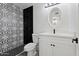 Stylish bathroom with black and white tile and modern vanity at 2504 N Papago Dr, Tempe, AZ 85288