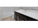 Clean bathroom with dark vanity and white countertop at 2518 N Pony Ln, Casa Grande, AZ 85122