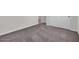 Simple bedroom with neutral carpet and double doors at 2518 N Pony Ln, Casa Grande, AZ 85122