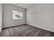 Bright bedroom with neutral carpeting and large window at 2518 N Pony Ln, Casa Grande, AZ 85122