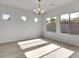 Bright dining room with large windows and a chandelier at 2518 N Pony Ln, Casa Grande, AZ 85122