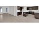 Open concept kitchen with dark cabinetry and island at 2518 N Pony Ln, Casa Grande, AZ 85122