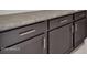 Dark brown cabinets with modern silver hardware at 2518 N Pony Ln, Casa Grande, AZ 85122