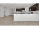Open concept kitchen with island and dark brown cabinetry at 2518 N Pony Ln, Casa Grande, AZ 85122