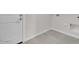 Simple laundry room with door and tile floor at 2518 N Pony Ln, Casa Grande, AZ 85122
