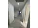 Bright hallway with wood-look floors and access to bedrooms at 2647 S Athena --, Mesa, AZ 85209