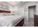 Well-lit bedroom with a queen bed and built-in closet at 26653 W Firehawk Dr, Buckeye, AZ 85396