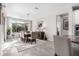 Bright dining room with wooden table, chairs, and access to backyard at 26653 W Firehawk Dr, Buckeye, AZ 85396