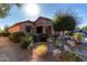Single-story home with stone accents and landscaped front yard at 26653 W Firehawk Dr, Buckeye, AZ 85396