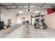 Spacious garage with golf cart, storage cabinets, and extra space at 26653 W Firehawk Dr, Buckeye, AZ 85396