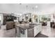 Spacious kitchen boasts an island, stainless steel appliances, and granite countertops at 26653 W Firehawk Dr, Buckeye, AZ 85396