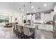 Modern kitchen with white cabinets, granite countertops, and large island at 26653 W Firehawk Dr, Buckeye, AZ 85396