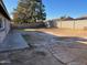 Large backyard with a block wall and a small paved patio area at 3946 W Cholla St, Phoenix, AZ 85029