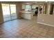 Bright dining area with tile floors and access to the backyard at 3946 W Cholla St, Phoenix, AZ 85029