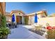 Relax in this charming courtyard with seating and beautiful plants at 41716 N Laurel Valley Way, Anthem, AZ 85086