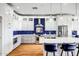 Modern kitchen featuring white cabinets and blue tile backsplash at 41716 N Laurel Valley Way, Anthem, AZ 85086