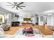 Relaxing living room featuring a piano, comfy seating and large TV at 41716 N Laurel Valley Way, Anthem, AZ 85086