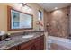 Bathroom with granite vanity, tiled shower, and bathtub at 5681 E Canyon Ridge North Dr, Cave Creek, AZ 85331