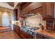 Gourmet kitchen with stainless steel appliances and custom wood cabinetry at 5681 E Canyon Ridge North Dr, Cave Creek, AZ 85331