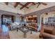 Open living area with leather sofas and high ceilings at 5681 E Canyon Ridge North Dr, Cave Creek, AZ 85331