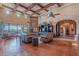 Spacious living room features high ceilings, exposed beams, and a tile floor at 5681 E Canyon Ridge North Dr, Cave Creek, AZ 85331