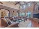 Large living room with fireplace and high ceilings at 5681 E Canyon Ridge North Dr, Cave Creek, AZ 85331