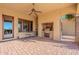 Outdoor kitchen and patio area with brick fireplace at 5681 E Canyon Ridge North Dr, Cave Creek, AZ 85331