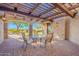 Covered patio with pergola and outdoor dining set at 5681 E Canyon Ridge North Dr, Cave Creek, AZ 85331