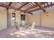 Covered patio with pergola and outdoor dining set at 5681 E Canyon Ridge North Dr, Cave Creek, AZ 85331