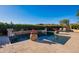 Resort-style pool with a fountain and ample seating at 5681 E Canyon Ridge North Dr, Cave Creek, AZ 85331