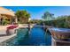 Inviting swimming pool with fountain and spacious deck at 5681 E Canyon Ridge North Dr, Cave Creek, AZ 85331
