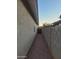 Side yard access with gravel pathway at 6154 W Echo Ln, Glendale, AZ 85302