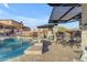 Inviting pool area with covered patio and seating at 6974 S Hohokam Pl, Gold Canyon, AZ 85118