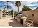 Outdoor grilling station with seating, perfect for entertaining at 7000 N Via Camello Del Sur -- # 37, Scottsdale, AZ 85258