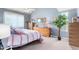 Spacious bedroom with striped bedding and a dresser at 7000 N Via Camello Del Sur -- # 37, Scottsdale, AZ 85258