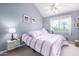 Bedroom with a striped comforter and window coverings at 7000 N Via Camello Del Sur -- # 37, Scottsdale, AZ 85258