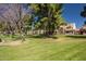 Landscaped grounds with lush lawns and mature trees at 7000 N Via Camello Del Sur -- # 37, Scottsdale, AZ 85258