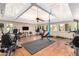 Well-equipped home gym featuring various exercise machines, weights, and flooring at 7000 N Via Camello Del Sur -- # 37, Scottsdale, AZ 85258
