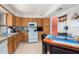 Eat-in kitchen with wood cabinets and an electric stove at 7000 N Via Camello Del Sur -- # 37, Scottsdale, AZ 85258