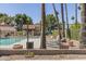 Community pool area with fence and lounge chairs at 7000 N Via Camello Del Sur -- # 37, Scottsdale, AZ 85258