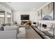 Living area featuring gray sectional sofa and two armchairs at 7637 W Minton St, Laveen, AZ 85339