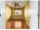 Bedroom with hardwood floors, ceiling fan and window coverings at 8411 W Myrtle Ave, Glendale, AZ 85305