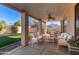 Covered patio with seating area and ceiling fan at 846 W Kroll Ave, Gilbert, AZ 85233