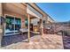 Covered patio with tiled flooring and a grill at 8953 W Townley Ave, Peoria, AZ 85345