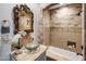 Elegant bathroom with a soaking tub and ornate mirror at 10040 E Happy Valley Rd # 512, Scottsdale, AZ 85255
